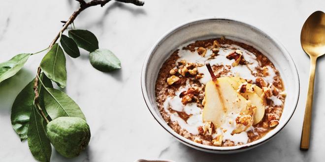 a bowl of pear porridge and a dish of honey